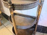 a wooden shelf that has a basket on top of it