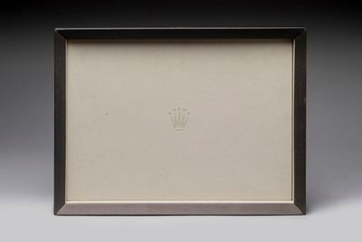 an image of a framed picture of a hand with a crown on it