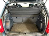 a trunk of a small car with its doors open