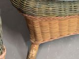 a wicker chair with a blue blanket on top of it