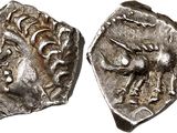 a silver coin with an image of a man on it