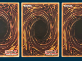 three cards that have a picture of a black hole in them