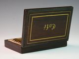 a small wooden box with a book on top of it