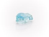 a close up of a blue diamond on a white surface