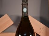 a bottle of wine that is sitting on a table