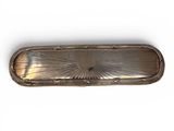 an image of a silver plate with a design on it