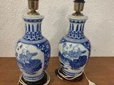 two blue and white vases on a wooden table