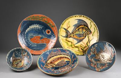 five plates with different designs on them on a table