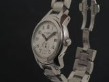 a close up of a watch on a metal bracelet
