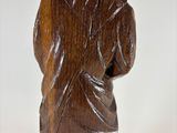 statue of a woman with a hood on her head and a hood on her head