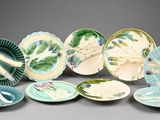 a lot of plates that are sitting on a table