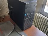 a desktop computer sitting on top of a desk next to a mouse