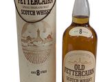 une photo d'une bouteille de whisky écossais « Old Fettercain » posée à côté d'une boîte en carton
