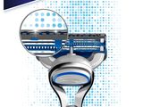 a close up of a razor on a white background with blue dots