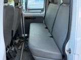 a white van with two seats in the back of it