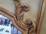 a mirror that has a sign on it in front of it