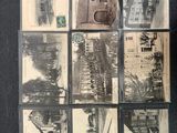a lot of old black and white photos on a table