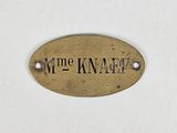 a sign that says time knaf on a white wall