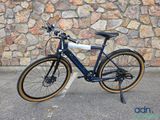 a bike that is parked in front of a stone wall