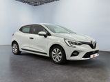 a white car in a white room with a black floor