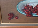 a painting of cherries in a bowl on a table
