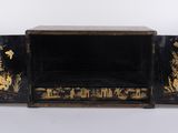 an image of a black and gold box with flowers on it