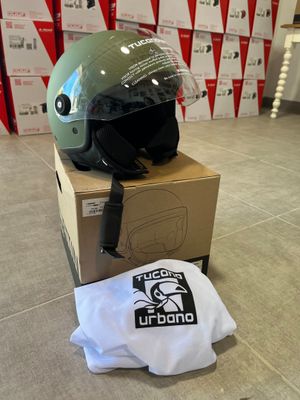 a helmet sitting on top of a box on the floor