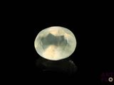 an image of a white quartz stone on a black surface