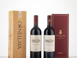 deux bouteilles de vin et une boîte de vin posées sur une table