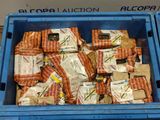 a blue bin filled with packages of food sitting on top of a table