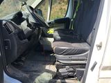 the interior of a van with the door open and the driver ' s seat down