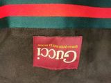 a close up of a gucci bag with a red and green stripe