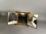 a small mirror that is sitting on a table