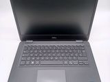 the dell laptop is open and ready to be used