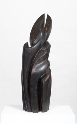 statue of a woman holding a leaf on a white pedestal