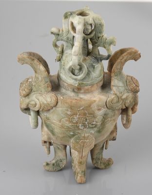 an image of a statue of an elephant and a bird on a pedestal
