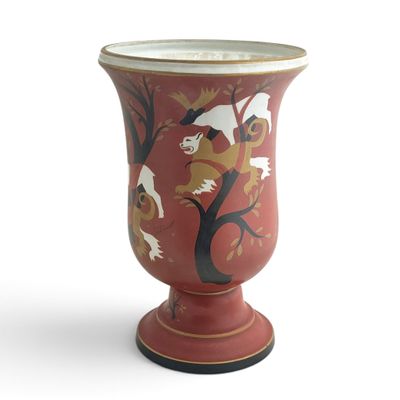 a red vase with a bird design on it