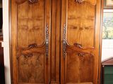 an image of a large wooden armoire in a room