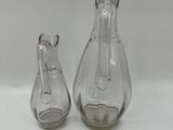 pair of clear glass vases on a white background