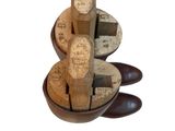 several wooden blocks in a bowl on a white surface