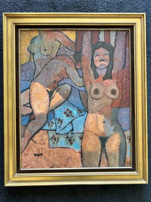 painting of two nudes in a gold frame hanging on a blue wall