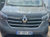 the front view of a grey car parked in a parking lot