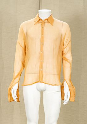 mannequin dressed mannequin wearing a yellow shirt and white pants