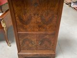 an image of a wooden cabinet with marble top