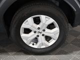 a close up of a tire on a car ' s rim