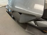 a close up of a motorcycle parked on the side of the road