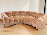 a couch that is sitting on a hard wood floor