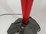 a red lamp that is on top of a table