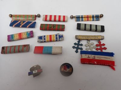 several different types of ribbons and pins laid out on a table