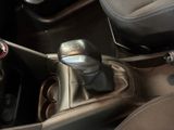 a close up of a car ' s gear box with a cup holder in it